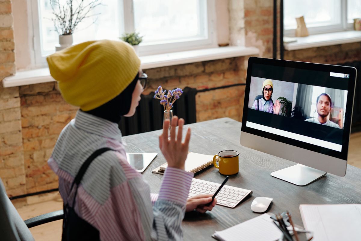 A woman on a video call from her home office